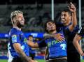 Taufa Funaki (C) was one of the Blues' tryscorers in the big win over the Highlanders in Auckland. (Andrew Cornaga/AAP PHOTOS)