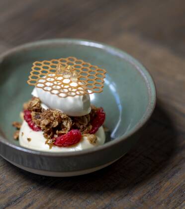 Anzac biscuit cheesecake, Pialligo honey, whiskey, local raspberry. Picture by Gary Ramage 