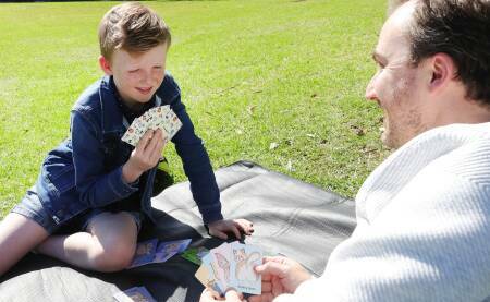 Levi and Evan live in Weston Creek and came up with the card game during the COVID lockdowns. Picture by Sylvia Liber