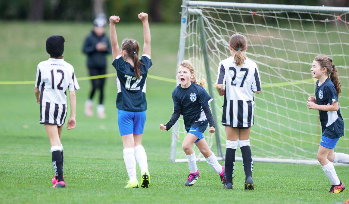 Majura Lightning's Elsie Monahan celebrates a goal against Weston Creek Molonglo on Saturday. Picture by Sitthixay Ditthavong