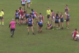 A brawl between Gungahlin and Ainslie players moments before the final siren. Picture AllInSports