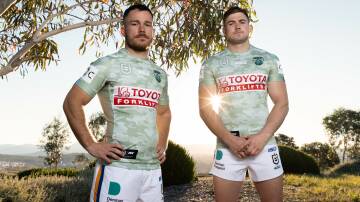 Tom Starling and Hudson Young wearing the ANZAC Round Raiders jerseys at the National Arboretum near the Forest of Remembrance. Picture by Sam Gibson/Raiders