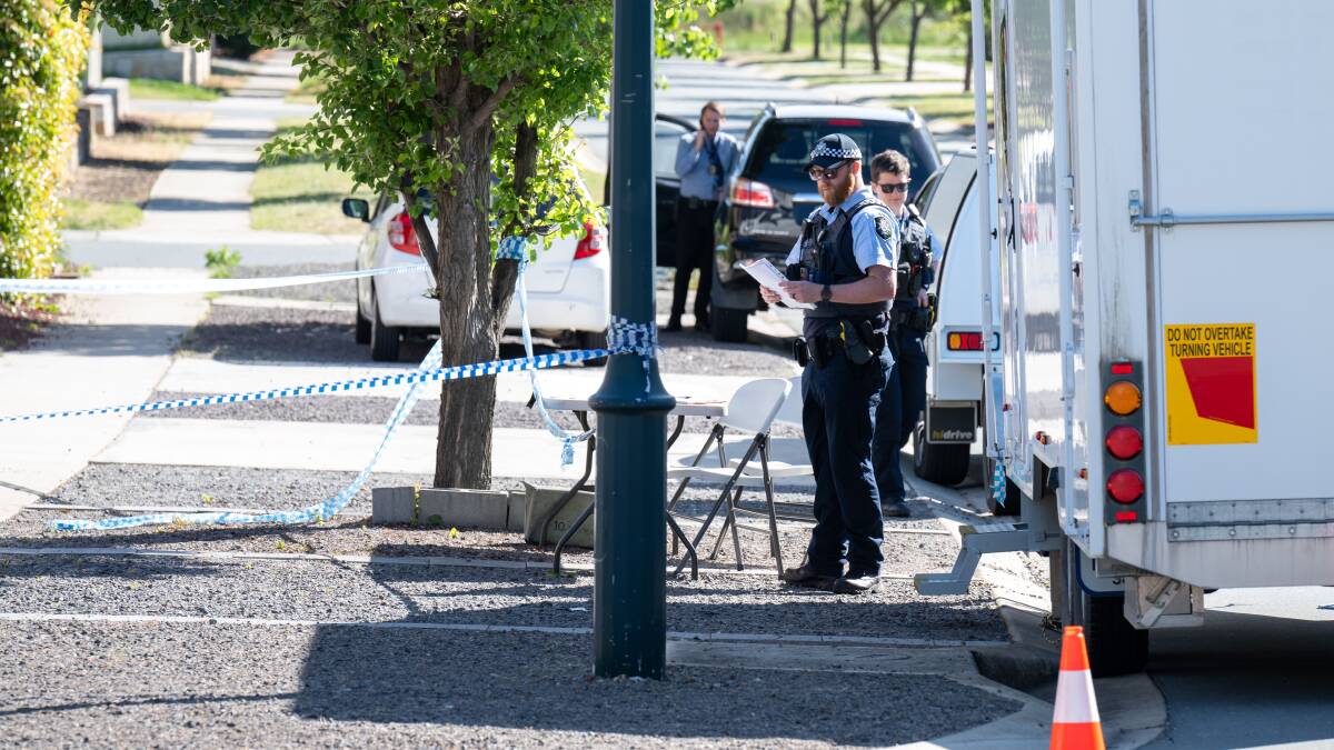 Police on the scene in Bruce the morning after the alleged murder. Picture by Elesa Kurtz