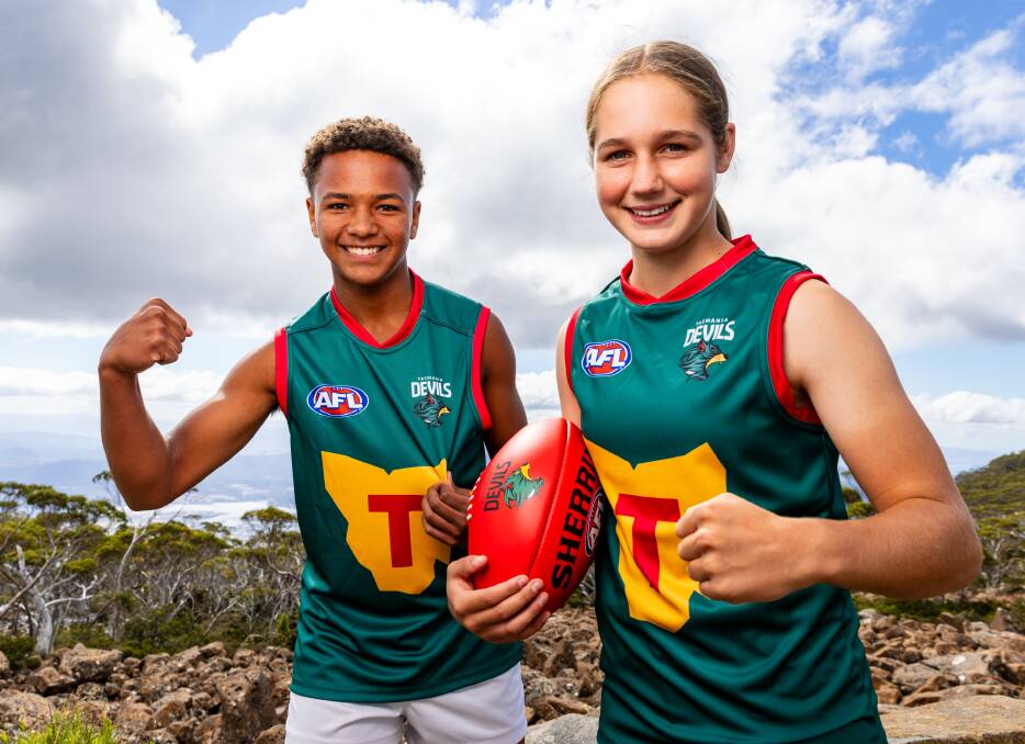 Shaun Kongwa and Mia Barwick showing off the Tasmania Devils guernsey. Picture by Solstice Digital