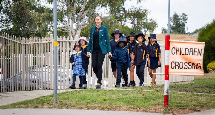 Ngunnawal Primary School deputy principal Emma Davidson and students prepare for Friday's National Walk Safely to School Day. Picture by Elesa Kurtz