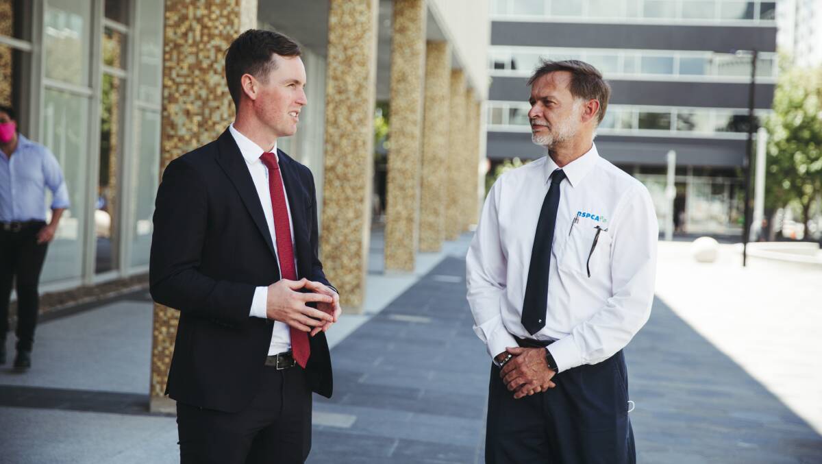 Minister for Transport and City Services Chris Steel and Animal Care Manager RSPCA ACT Simon Yates discuss the new legislation. Picture: Dion Georgopoulos 