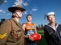 Corporal Jordan Smyth, Giant Tom Green, and Leading Seaman Stephanie Went at Manuka Oval. Picture by Sitthixay Ditthavong