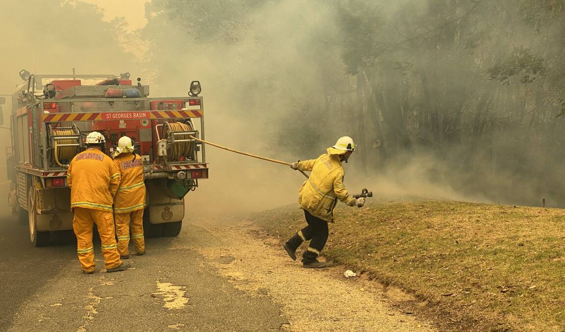 NSW Rural Fire Service crews fight the blaze near East Lynne. Picture: Stuart Thompson