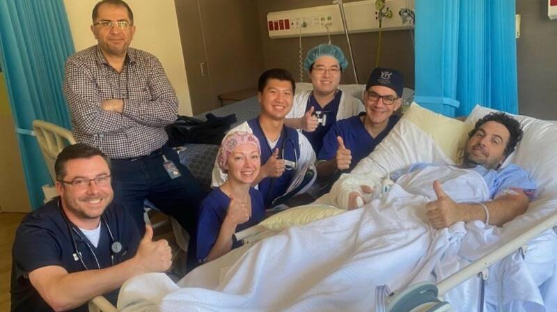 Members of the medical team after the surgery with Adam Symons. Left to right: Dr David Walton, Dr Kourosh Tavanger, Dr Tetyana Kelly, Dr Kitiphume Thamasiraphop, Dr Oliver Pan, Dr Ross Farhadieh, Adam Symons. Picture: Supplied