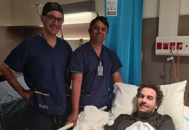  Dr Ross Farhadieh and Dr Krishna Rao with Adam Symons after the surgery. Picture: Supplied