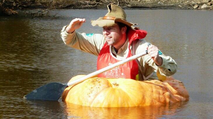 Adam isnt the only pumpkin paddler in our region. Tim paddled a pumpkin in the Collector Creek in the lead-up to the Collector Pumpkin Festival in 2013. Picture by Ben Roberts