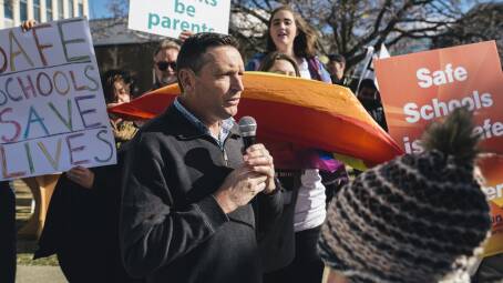 Lyle Shelton in 2017 at the ACT Legislative Assembly. He is surrounded by supporters of Safe Schools, which he was protesting against. Picture by Rohan Thomson 