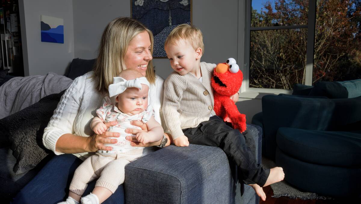 Sarah Dunbar with her children Maddie, 4 months, and Hamish, 2, who were conceived via IVF. Picture by Sitthixay Ditthavong