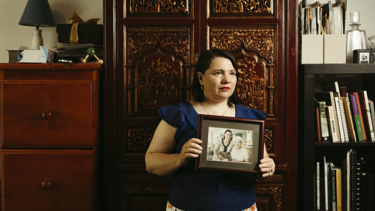 Serina Bird holds a photo picturing herself and Irene Barron, her grandmother. Picture: Dion Georgeopolous