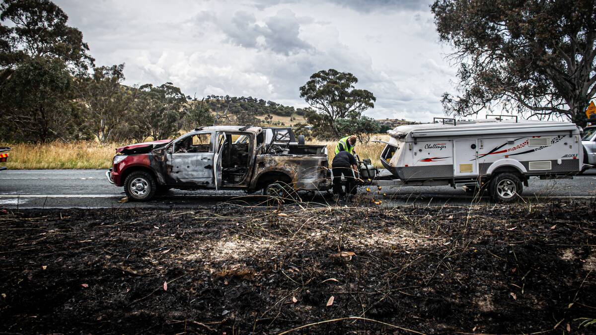 Spot fires spread to grass around the vehicle but the caravan appears undamaged. Picture by Karleen Minney