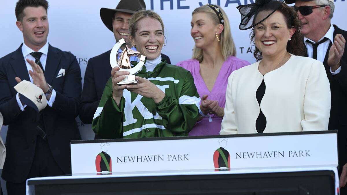 Canberra jockey Kayla Nisbet celebrates her win in Saturday's Country Championships final. Picture Bradley Photos