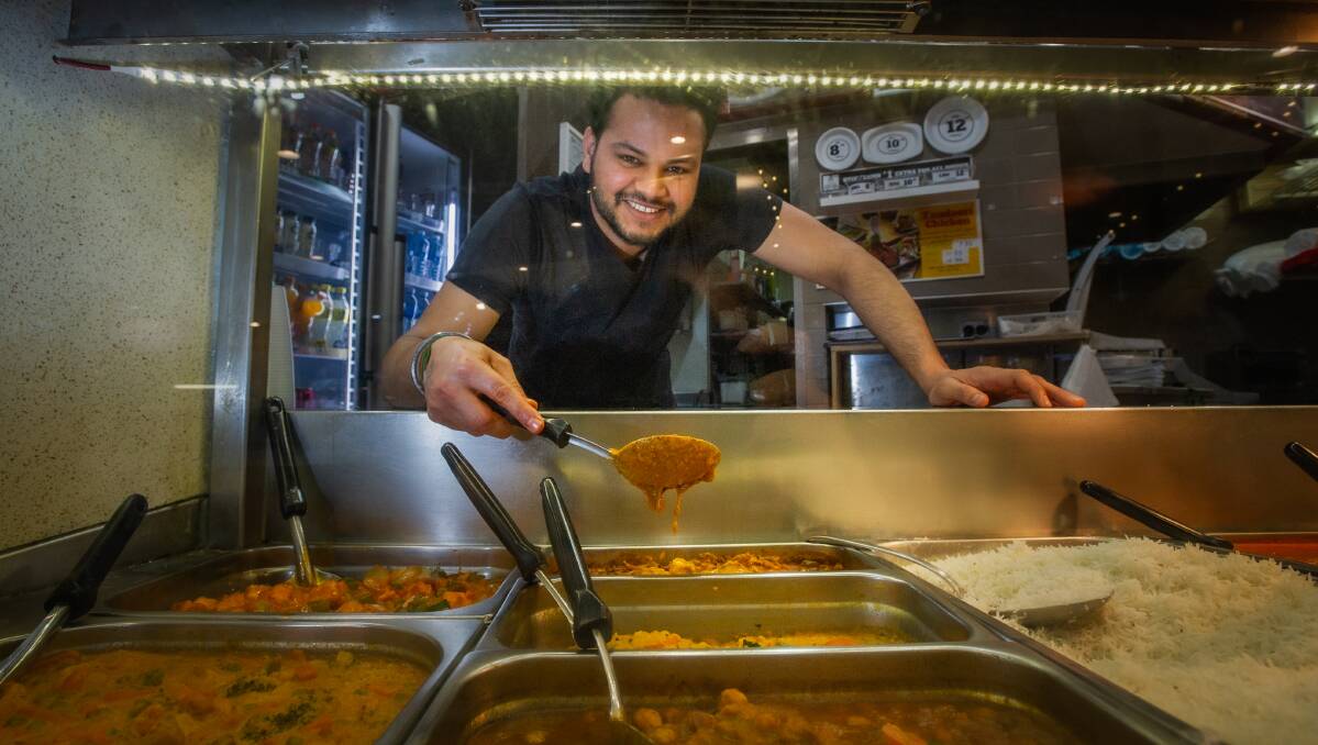 Grill and Spice employee Jiwan Pal Singh works in the Woden food hall. Picture: Karleen Minney