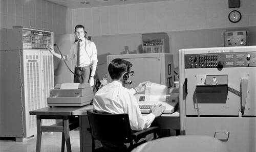 Bryan Sullivan (seated) in the control room at Honeysuckle Creek Tracking Station in 1967. He worked on the Apollo program from the beginning to the final mission, Apollo 17. Picture: Supplied