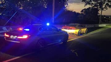 NSW Police pull over the Mustang on Conrod Straight. Picture Facebook
