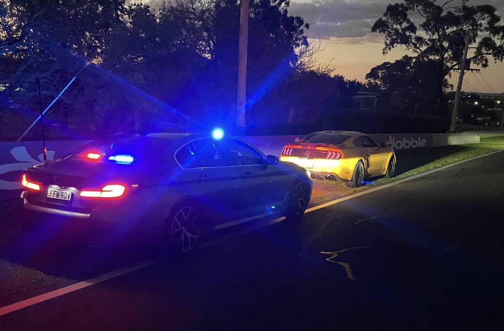 NSW Police pull over the Mustang on Conrod Straight. Picture Facebook