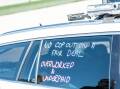 Industrial slogans on a police traffic car. Picture by Karleen Minney