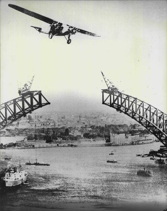 The Southern Cloud flying over the Sydney Harbour Bridge, 1932. Picture: Barry John Stevens