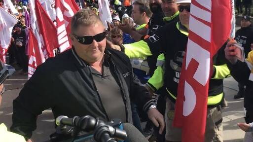 CFMMEU ACT secretary Jason O'Mara is given a guard of honour as he arrives at the ACT Magistrates Court for a court appearance in 2018. Picture: Supplied