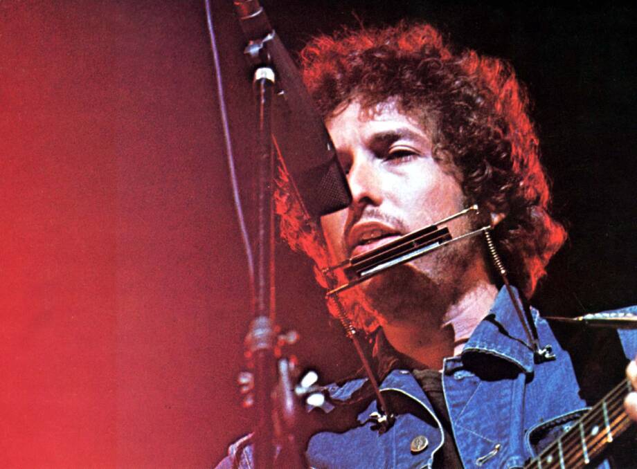 Bob Dylan plays The Concert for Bangladesh in 1975. Picture: Mary Evans