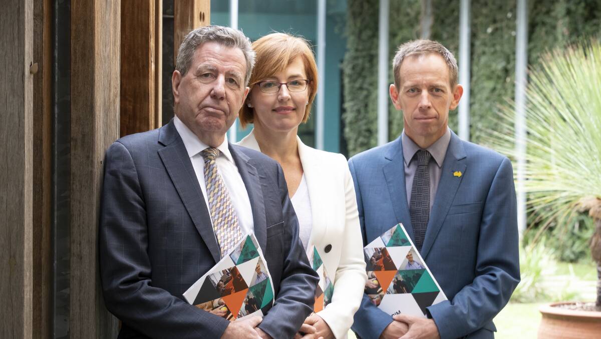 Consultant Mick Reid, former health minister Meegan Fitzharris, and Mental Health Minister Shane Rattenbury handing down the review's final report earlier this year. Picture: Sitthixay Ditthavong