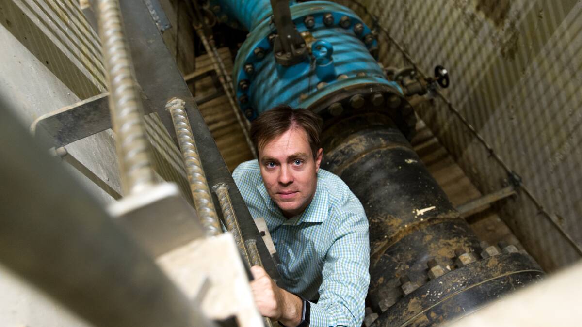 The National Capital Authority's chief operating officer, Lachlan Wood, with the flow control valve to be refurbished inside the Captain Cook Jet tunnels. Picture: Elesa Kurtz
