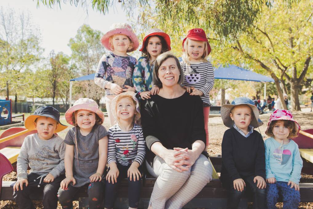 Director Veronique Danjou with children from the French-Australian Preschool, all three years old. Front from left: Marcus, Celia, Emanuelle, Max and Camille. Rear from left: Celeste, Ella, and Meredith. Photo: Jamila Toderas.