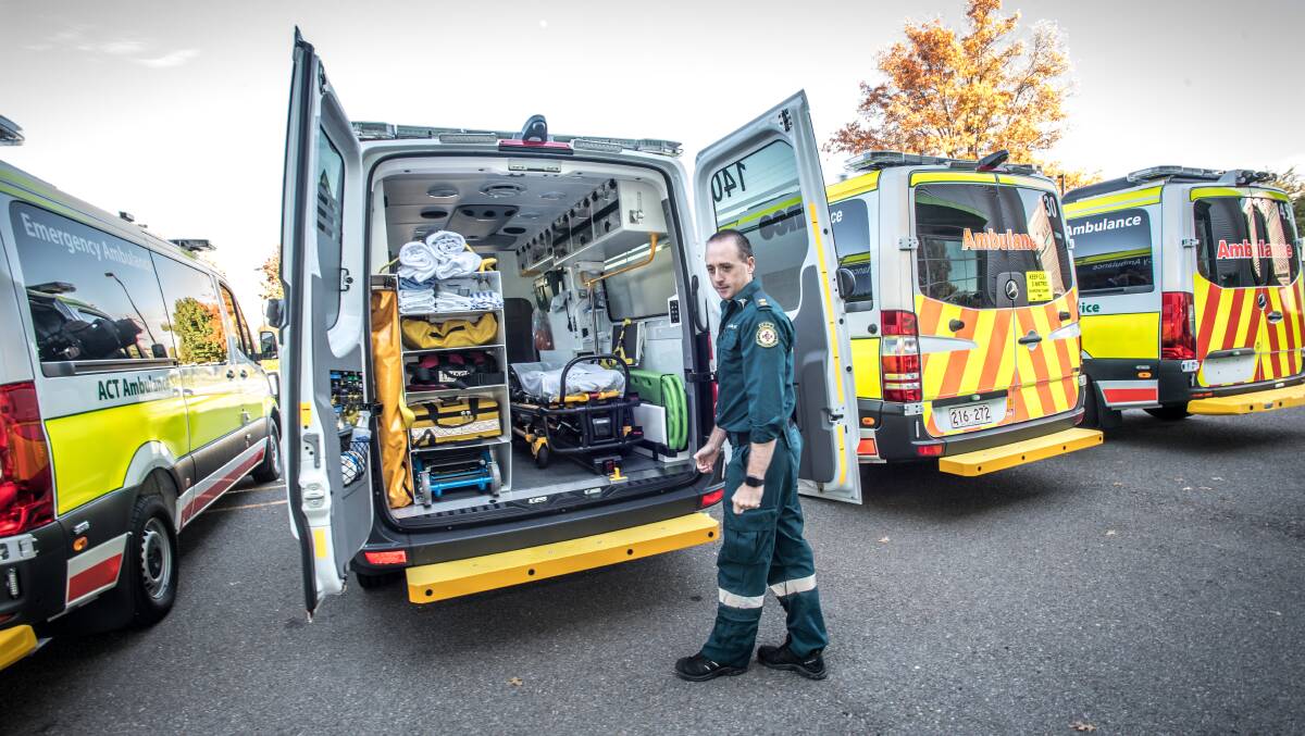 ACT paramedic Scott Lang checks out the new power stretcher feature. Photo: Karleen Minney