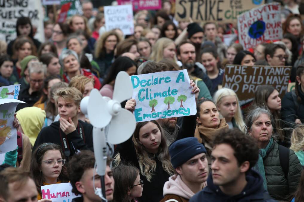 Protesters are seen during a climate rally in Melbourne on May 24, 2019. Wagga Wagga City Council has declared a climate emergency. Picture: AAP