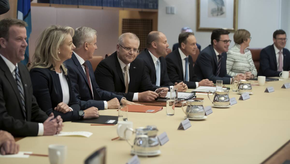 Prime Minister Scott Morrison with his new cabinet on Wednesday. Picture: Alex Ellinghausen.
