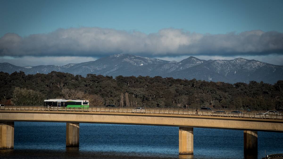 A light dusting of snow on the Brindabella's seen over the Commonwealth avenue bridge. Picture: Karleen Minney
