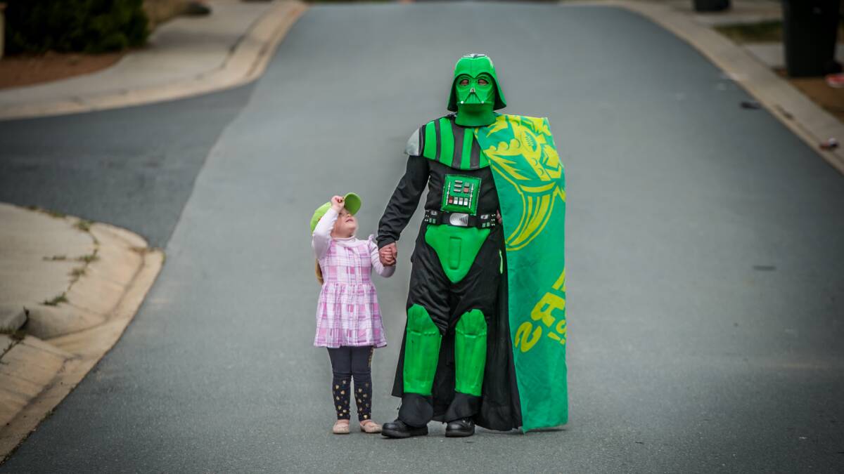 I am your father: Conrad Farrell, who dresses up as Darth Raider for Raiders matches in an adapted Darth Vader costume, pictured with daughter Willow, 4. Picture: Karleen Minney
