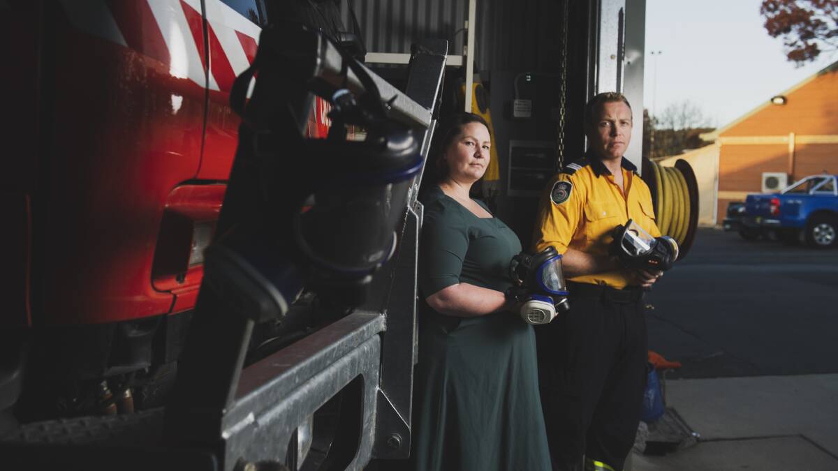 Queanbeyan RFS captain Nick Hornbuckle with Amelia Maria at the Queanbeyan RFS shed where she has donated new masks. Picture: Dion Georgopoulos