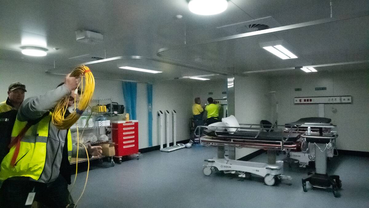 Maintenance crews inside one of the resuscitation bays in the temporary COVID-19 hospital. Picture: Karleen Minney