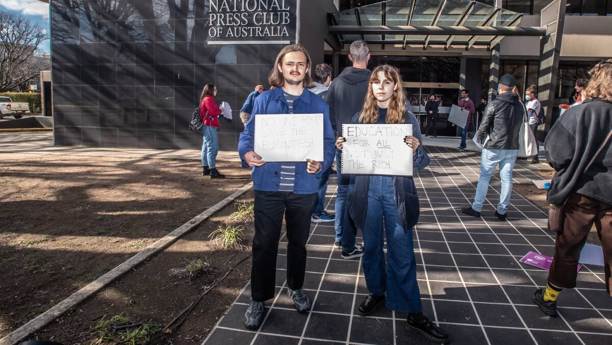 Students Thomas Redmayne and Imogen McKay protest university fee changes in front of the National Press Club on Friday. Picture: Karleen Minney