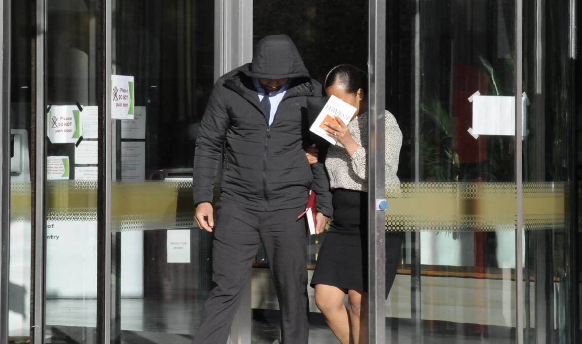 One of the alleged rapists, Simon Vunilagi, leaves the ACT courts on Thursday. Picture: Cassandra Morgan