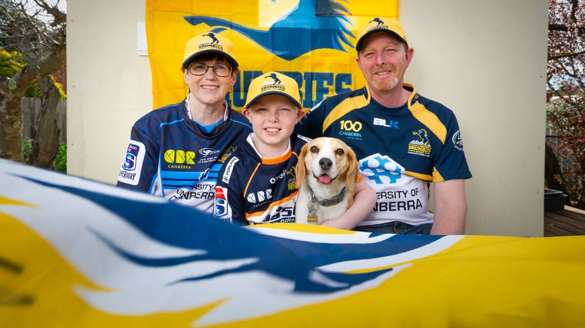 ACT Brumbies fan Christian Franklin, 10, has leukaemia and the Brumbies will be bringing him to the Super Rugby AU grand final on Saturday. Pictured with his parents Lisa and Don. Picture: Elesa Kurtz 