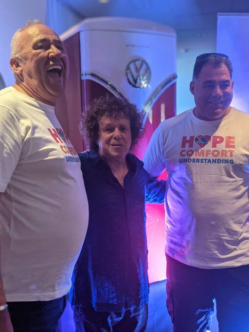 Peter Munday, a member of the Canberra Hospital Foundation board, and dealer-principal of Lennock Volkswagen, Leo Sayer and Raiders legenda Mal Meninga with the fridge Mal bought at the Can Give Day charity auction. Picture: Megan Doherty
