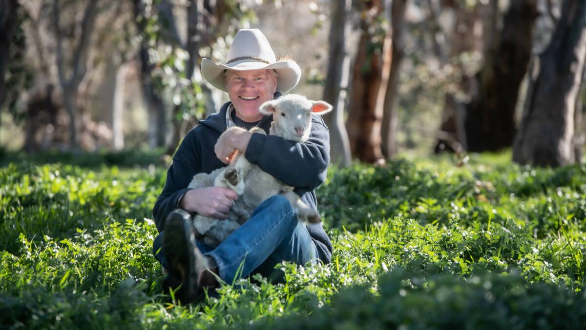 Gold Creek Station farmer Craig Starr with one of his spring lambs. Picture: Karleen Minney