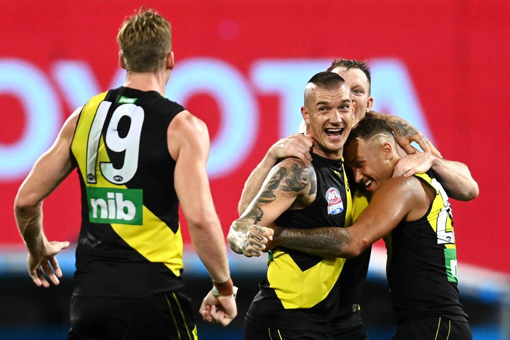 Dustin Martin celebrates one of his four goals for the Tigers in their 31-point grand final win over Geelong. Picture: Getty Images