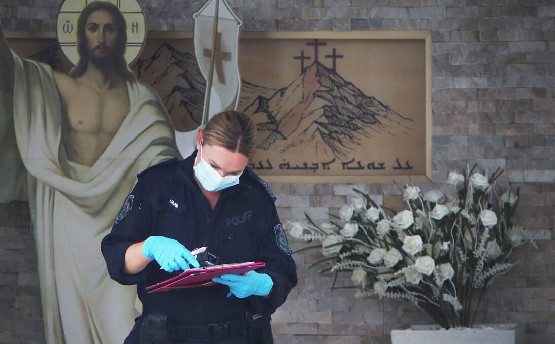  A member of NSW Forensic police at Christ The Good Shepherd Church in Syndey on Wednesday. Picture Getty Images