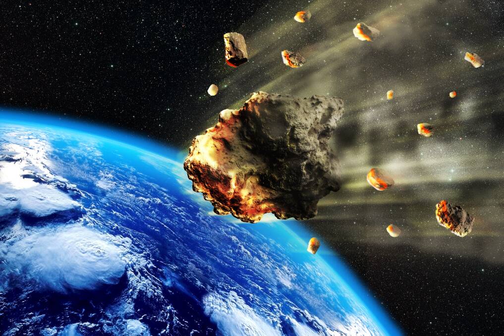 An illustration of asteroids heading towards Earth. Pieces of an asteroid safely stored inside spacecraft Hayabusa2 are due to land next month. Picture: Shutterstock
