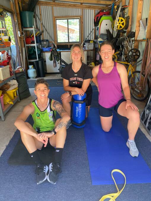 Michelle Heyman, Demi Koulizakis and Grace Maher are training in a garage. Picture: Supplied