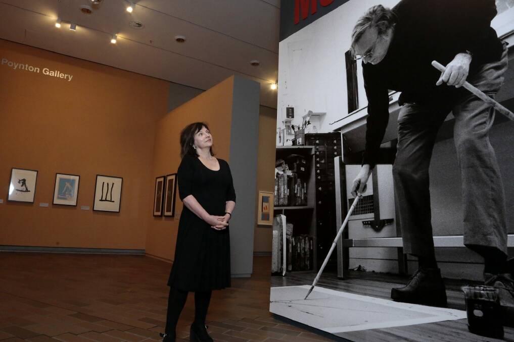 NGA senior curator Jane Kinsman studies a portrait of the artist at the Robert Motherwell exhibition. Photo: Jeffrey Chan