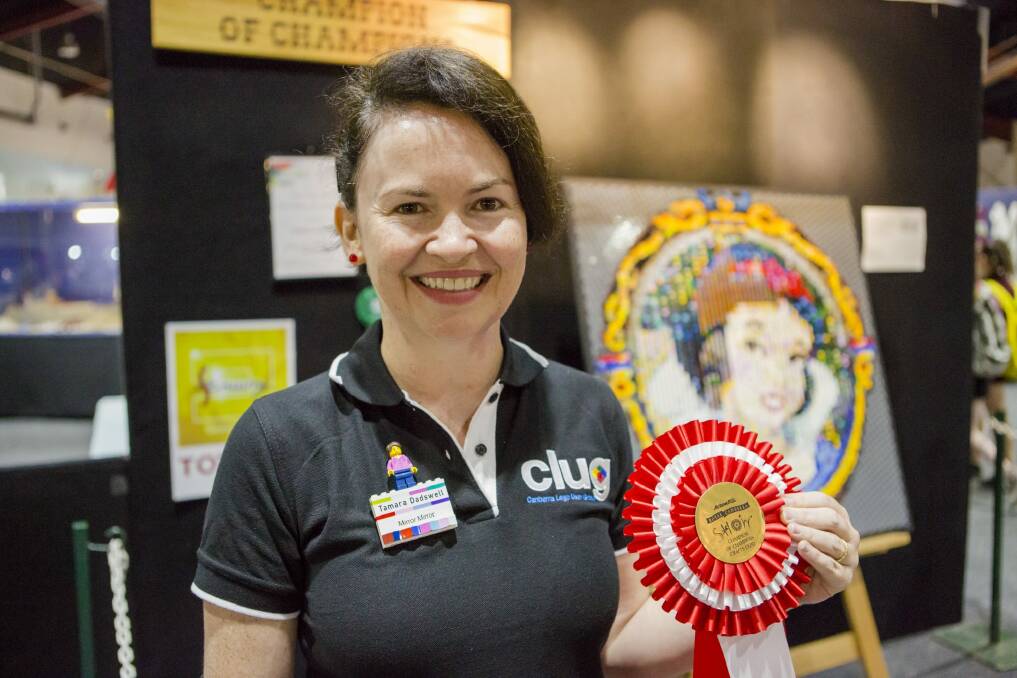 The Champion of Champions of The Royal Canberra show Craft Expo, Tamara Dadswell with "Mirror Mirror" her lenticular mosaic lego piece. Photo: Jamila Toderas