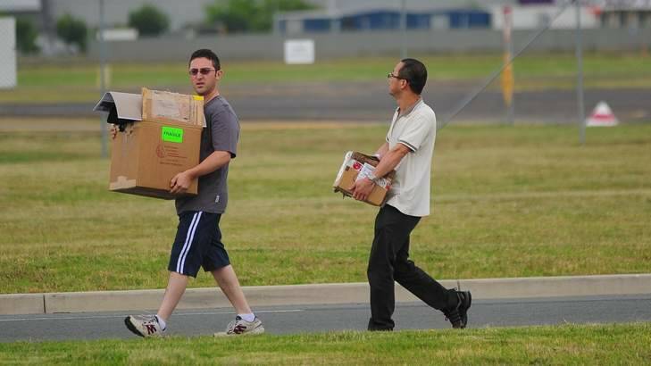 Packing up ... Staff leave Brindabella Airlines after the announcement. Photo: Katherine Griffiths